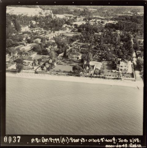 Aerial view of seaside bungalows and buildings at the Upper East Coast area in Siglap, Singapore. This shows the coastline up to Nallur Road on the right of the photograph. The beachside house at Nallur Road belonging to Tan Eng Ghee - who was the son of rubber magnate Tan Lark Sye, can be seen on the right of the photograph.