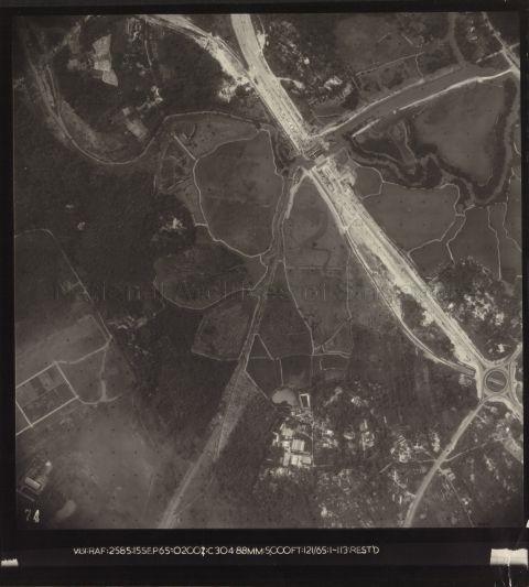 Jalan Ahmad Ibrahim under construction bridging the Jurong River. The Jurong Railway line can be seen parallel to bottom of the main road. The traffic circus is a junction between Jalan Ahmad Ibrahim and Jalan Bahru Selantan (predecessor of Jurong Town Hall Road)