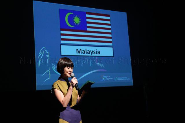 Emcee introducing performers at gala show held at Gallery Theatre, National Museum of Singapore, during launch of ASEAN Festival of the Arts