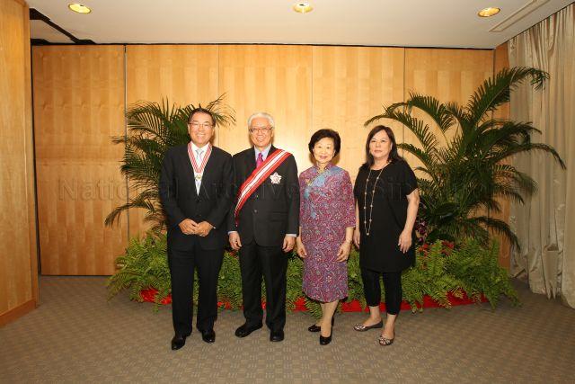 Group photograph of President and Mrs Tony Tan Keng Yam with recipient of Distinguished Service Order Medal, Chairman of DBS Group Holdings Peter Seah Lim Huat, and his wife during investiture of National Day awards at University Cultural Centre, National University of Singapore in Kent Ridge