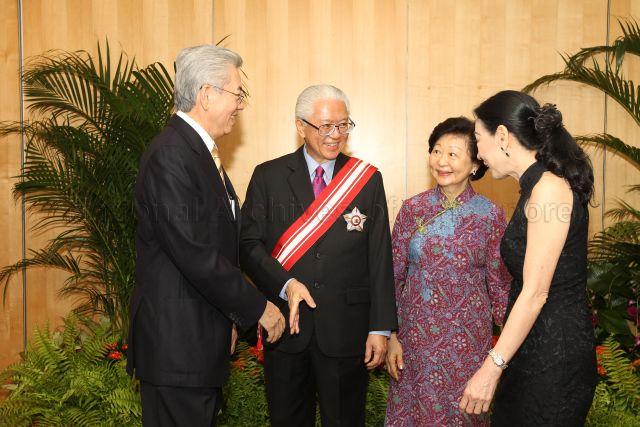 President and Mrs Tony Tan Keng Yam with recipient of Meritorious Service Medal, Chairman of National University of Singapore Board of Trustees Wong Ngit Liong, and his wife during photograph taking sessions at University Cultural Centre, National University of Singapore in Kent Ridge, after investiture ceremony of National Day awards