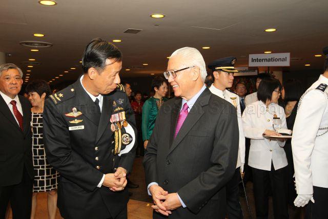 President Tony Tan Keng Yam with recipient of Public Administration Medal (Silver) (Military) and Chief of Staff Rear Admiral Tan Wee Beng from Republic of Singapore Navy at the reception during investiture of National Day awards at University Cultural Centre, National University of Singapore in Kent Ridge