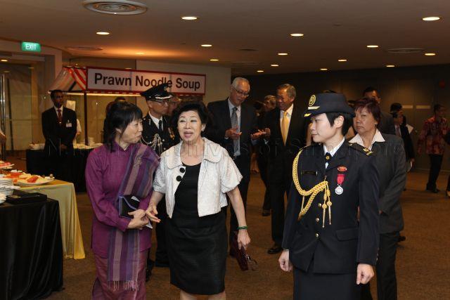 Mrs Goh Chok Tong and Ms Jane Ittogi (left), wife of Deputy Prime Minister and Minister for Finance Tharman Shanmugaratnam, at the reception during investiture of National Day awards at University Cultural Centre, National University of Singapore in Kent Ridge. Behind them are Emeritus Senior Minister Goh Chok Tong and Minister for Defence Dr Ng Eng Hen.