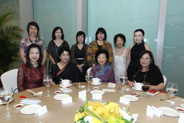 Group photograph of Mrs Mary Tan, wife of President Tony Tan Keng Yam, with spouses of National Day award recipients (seated, from left) Mrs Tan Ser Kiat, Mrs J Y Pillay, Mrs Seah Lim Huat; (standing, from left) Mrs Chan Heng Loon, Mrs Ng Kee Choe, Mrs Bilahari Kausikan, Mrs Neo Kian Hong, Mrs Kong Mun Kwong and Mrs Wong Ngit Liong at reception during investiture ceremony at University Cultural Centre, National University of Singapore in Kent Ridge