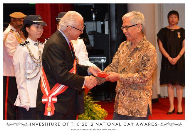 President Tony Tan Keng Yam presenting Public Service Star award to renowned Potter Iskandar Jalil at investiture of 2012 National Day awards held at University Cultural Centre Hall, National University of Singapore in Kent Ridge