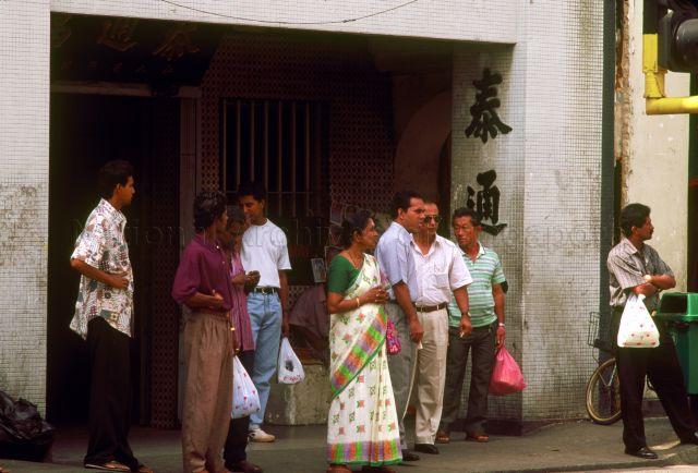 Pedestrians waiting to cross the road