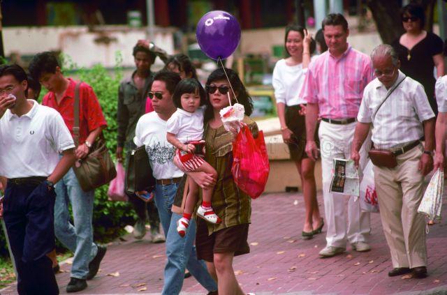 Woman carrying a child