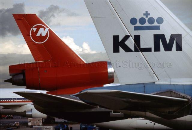 Tail sections of Northwest Airlines and KLM airplanes