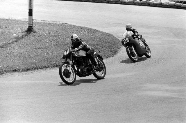 Attan Bujang on a Norton (number 44) followed by M A Hamed on an AJS 7R (number 28) during third Malaysia Grand Prix (also known as Malaysian Grand Prix) held at Upper Thomson Road, Singapore