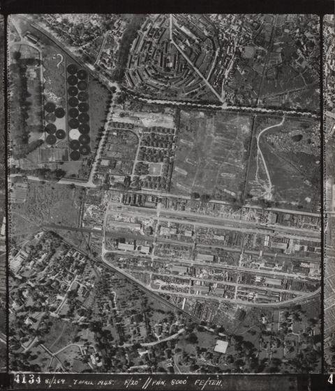Aerial view of Alexandra Road (running left to right across centre of photograph) and Tiong Bahru Road (running from top left corner to right edge of photograph). The long buildings arranged in circles in the upper middle of the photograph are in Bukit Merah estate. The many round structures in the upper left are filter beds of sewerage treatment works in the area where Gan Eng Seng School now stands. The Alexandra canal flows across the lower half of the map from right to left, becoming the Singapore River downstream to the left.