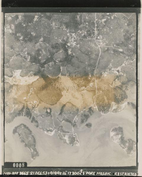 Aerial photograph shows the south-western coast of Singapore. The island on the left is Pulau Samulun, and the island on the right is Pulau Damar Laut. The land in the middle, between the 2 islands and connected by roads, houses the village Kampung Tanjung Kling.