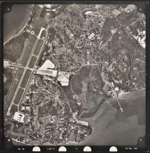 Aerial view of the Royal Air Force Changi airbase, Sungei Changi (bottom left), Sungei Selarang, Sungei Loyang, and Loyang, Singapore