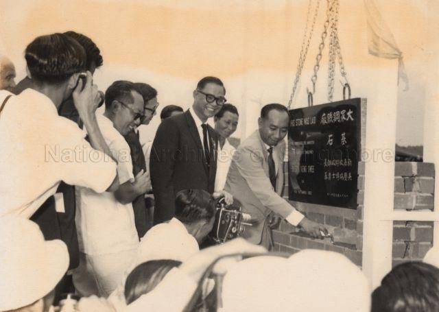 Minister of Finance Dr Goh Keng Swee laying the foundation stone of National Iron and Steel Mill at Jurong Industrial Estate. Standing next to him is Chairman of National Iron and Steel Mills Limited Soon Peng Yam.