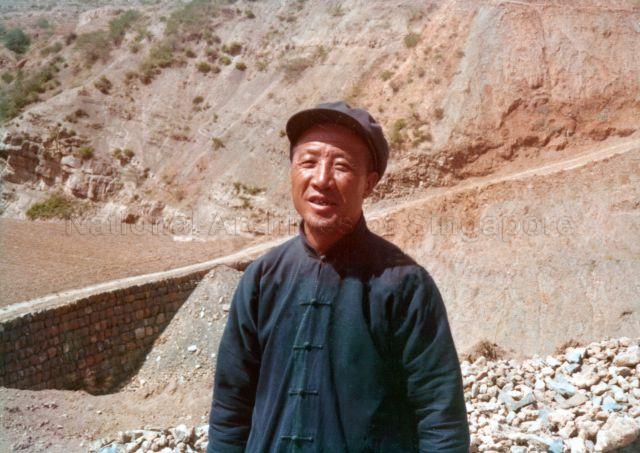 Chinese man in Zhongshan suit (also known as Mao suit) posing for photographs at Sian (Xi'an) in Shensi (Shaanxi) Province during visit of Singapore goodwill mission led by Prime Minister Lee Kuan Yew to China