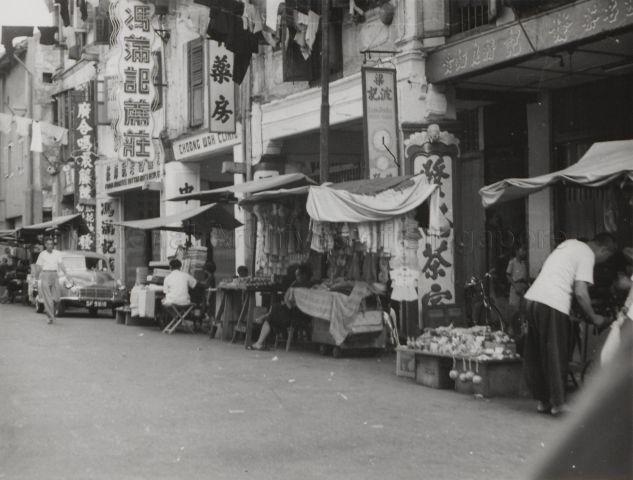 Street vendors in Chinatown. The photo depicts street vendors along Smith Street.