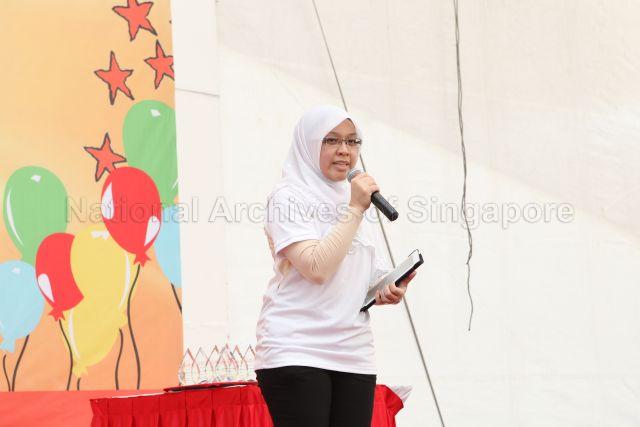 Ang Mo Kio Member of Parliament Dr Intan Azura Mokhtar making a speech at All C.A.R.E. Harmony Trail Cum Harmony Night organised by Ang Mo Kio Group Representation Constituency (GRC) And Sengkang West held at open space along Ang Mo Kio Avenue 8, near Ang Mo Kio Central 2 (next to Grandeur 8 condominium)