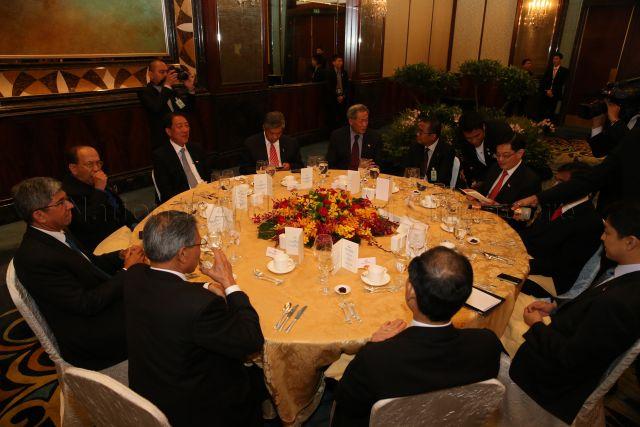 Singapore and Malaysian ministers having lunch during bilateral leaders' retreat at Shangri-la Hotel. Clockwise from bottom left, Singapore Minister for Communications and Information Yaacob Ibrahim (face in profile), Malaysian Minister for Information, Communications and Culture Rais Yatim, Singapore Deputy Prime Minister Teo Chee Hean, Malaysian Minister for Defence Ahmad Zahid Hamidi, Singapore Minister for Defence Ng Eng Hen, Malaysian Minister for Higher Education Mohamed Khaled Nordin, Singapore Minister for Education Heng Swee Keat, Malaysian Minister for Human Resources S Subramaniam and Singapore Senior Minister of State for National Development Tan Chuan Jin.