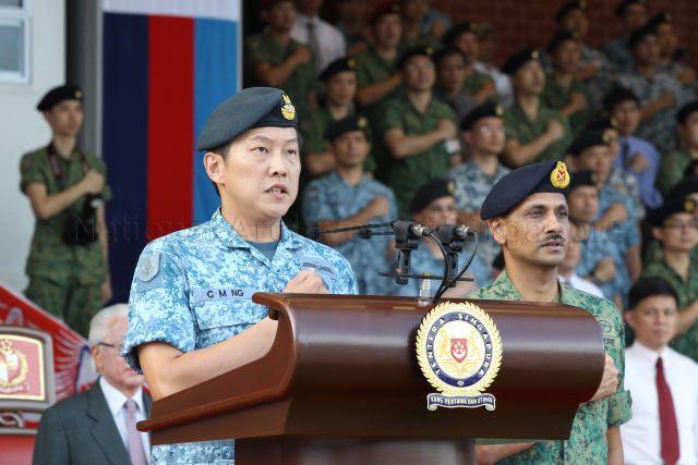 Chief of Defence Force Lieutenant-General Ng Chee Meng (standing behind rostrum) leading Singapore Armed Forces (SAF) personnel in reciting the SAF pledge to reaffirm their loyalty to the nation and their commitment to the defence of Singapore during SAF Day parade at SAFTI Military Institute