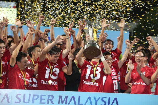 Lions XII football players celebrating after football match between LionsXII and Felda United in the final round of Malaysian Super League 2013 held at Jalan Besar Stadium