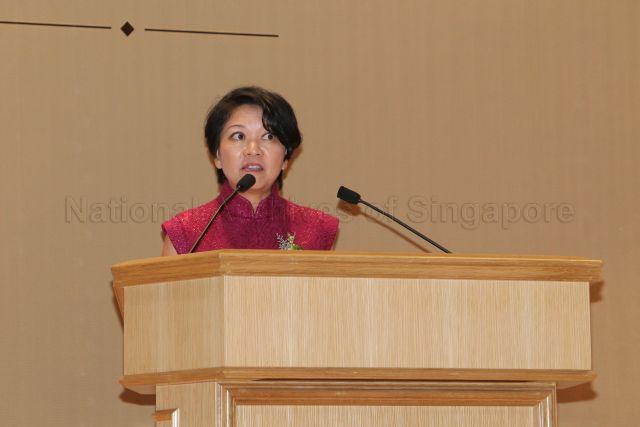 Principal of Raffles Institution, Lim Lai Cheng (wearing red dress) speaking on stage during Raffles Institution's 190th Anniversary Celebrations and the 90th Anniversary Dinner of the Old Rafflesians' Association held at Raffles Institution