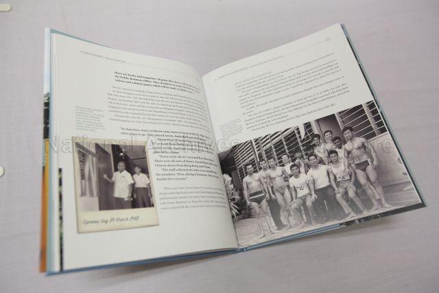 Photo showing pages of '50 years in Pek Kio: Rejuvenating the past' book taken during official opening of New Pek Kio Community Centre (CC) at 21 Gloucester Road and 50th anniversary of the old CC. Pek Kio Community Centre