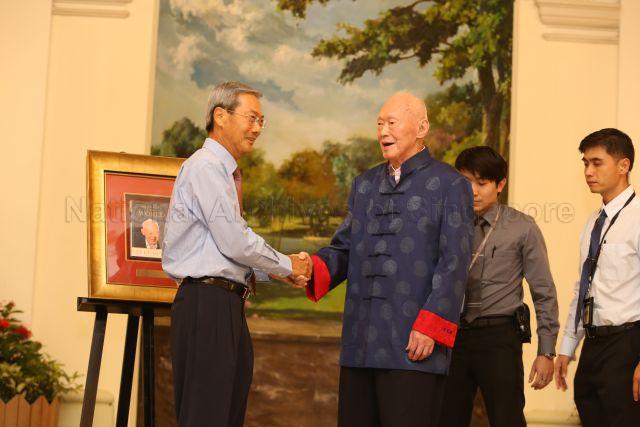 Singapore Press Holdings (SPH) Chairman Dr Lee Boon Yang congratulating former minister mentor Lee Kuan Yew during the launch of his new book, "One Man's View of the World", held at Istana