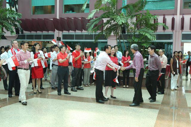 Member of Parliament for Chua Chu Kang Group Representation Constituency (GRC) Zaqy Mohamad (centre) welcoming Minister for Communications and Information Dr Yaacob Ibrahim to National Day Observance Ceremony at Artrium, Old Hill Street Police Station. Acting Minister for Culture, Community and Youth and Senior Minister of State for Ministry of Communications and Information Lawrence Wong (right) is standing behind Minister for Communications and Information Dr Yaacob Ibrahim. Member of Parliament for Tampines Group Representation Constituency (GRC) Baey Yam Keng (wearing red shirt) is pictured on the left.