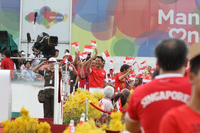 Chua Chu Kang Group Representation Constituency (GRC) Member of Parliament Zaqy Mohamad (centre) attending National Day Parade 2013 at the Float @ Marina Bay.