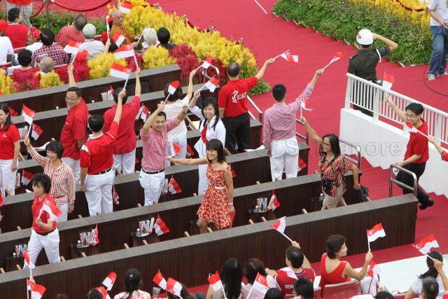 Nominated Member of Parliament Mary Liew (first row, far left), Nominated Member of Parliament Janice Koh (first row, second from left), Nominated Member of Parliament Faizah Jamal (first row, third from left), Non-Constituency Member of Parliament Gerald Giam Yean Song (first row, far right), East Coast Group Representation Constituency Member of Parliament Jessica Tan Soon Neo (second row, second from right) and West Coast Group Representation Constituency Member of Parliament Foo Mee Har (second row, far left) are attending National Day Parade 2013 at the Float @ Marina Bay.