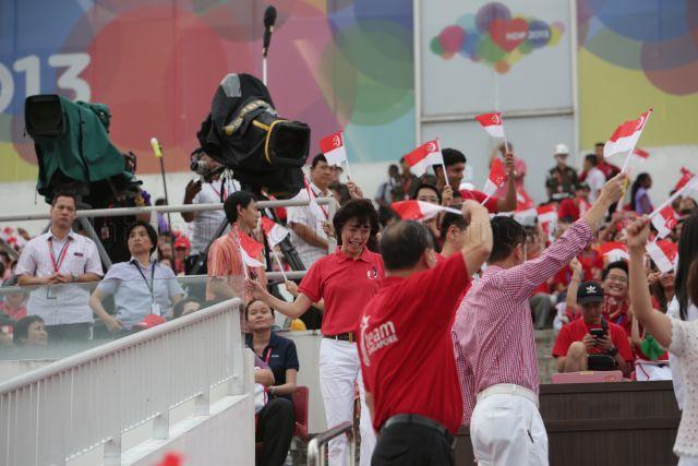 Nominated Member of Parliament Mary Liew (centre) attending National Day Parade 2013 at the Float @ Marina Bay.