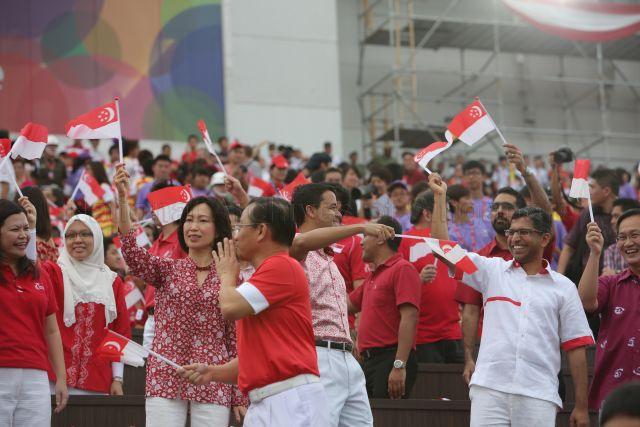 Mountbatten Single Member Constituency Member of Parliament Lim Biow Chuan (right), Bishan-Toa Payoh Group Representation Constituency Member of Parliament Hri Kumar Nair (second from right), Tampines Group Representation Constituency Member of Parliament Irene Ng Phek Hoong (fourth from right) and Pasir Ris-Punggol Group Representation Constituency Member of Parliament Penny Low (fifth from right) are attending National Day Parade 2013 at the Float @ Marina Bay.