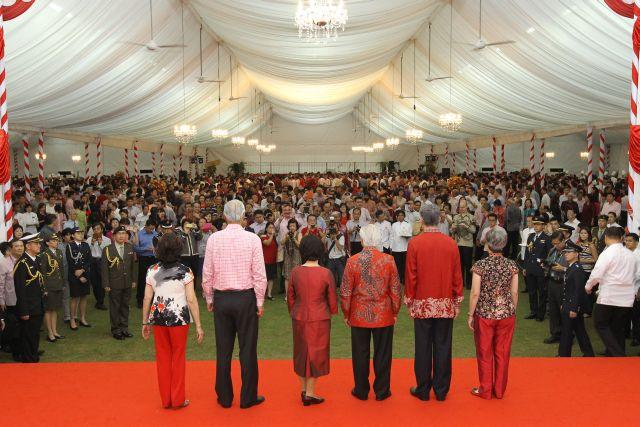 From left: Emeritus Senior Minister Goh Chok Tong's wife Madam Tan Choo Leng (back facing camera), Emeritus Senior Minister Goh Chok Tong (back facing camera), First Lady Mrs Mary Tan (back facing camera), President Tony Tan (back facing camera), Prime Minister Lee Hsien Loong (back facing camera) and his wife Madam Ho Ching (back facing camera) are attending National Day reception at Istana lawn.