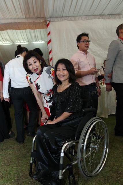 Emeritus Senior Minister Goh Chok Tong's wife Madam Tan Choo Leng (left) is pictured with a guest at National Day reception at Istana lawn.