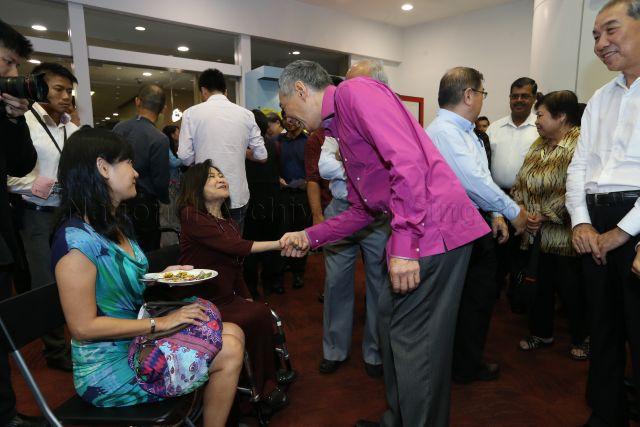 Prime Minister Lee Hsien Loong and lawyer Ms Chia Yong Yong exchanging greetings at the reception during National Day Rally at Institute of Technical Education (ITE) headquarters and College Central in Ang Mo Kio