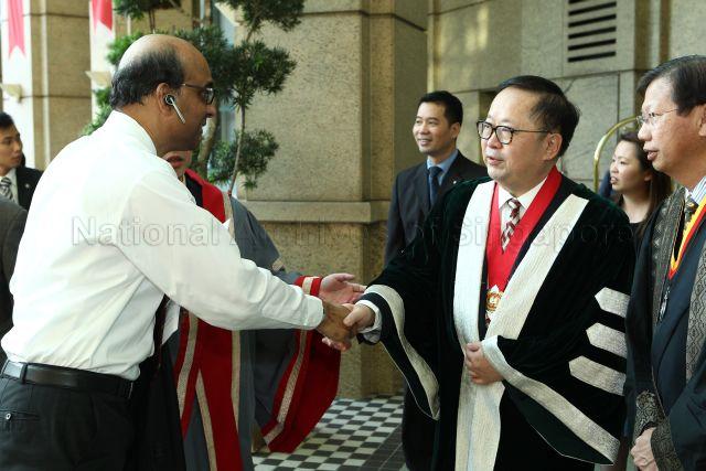 Minister of Finance Tharman Shanmugaratnam is shaking hands with President of the Hong Kong Academy of Medicine Donald Li Kwok Tung at Induction Comitia 2013 and 21st Gordon Arthur Ransome Oration at Grand Copthorne Waterfront Hotel.