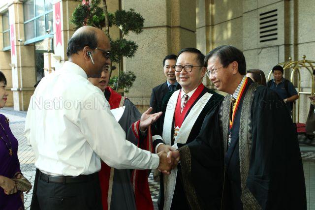 Minister of Finance Tharman Shanmugaratnam is shaking hands with Master Academy of Medicine of Malaysia Dr Chang Keng Wee at Induction Comitia 2013 and 21st Gordon Arthur Ransome Oration at Grand Copthorne Waterfront Hotel. President of the Hong Kong Academy of Medicine Donald Li Kwok Tung is pictured in the centre.
