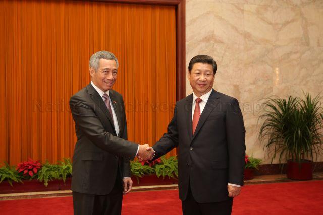 Prime Minister Lee Hsien Loong is shaking hands with Chinese President Xi Jinping at the Great Hall of the People in Beijing. This is a picture taken during Prime Minister Lee Hsien Loong’s seven-day official visit to China.