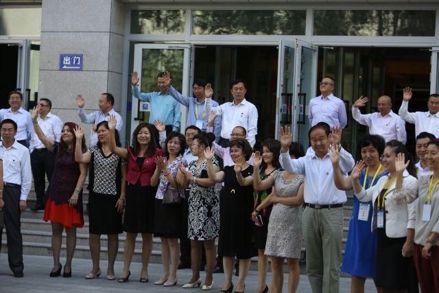 Locals waving goodbye at Xinjiang Normal University. This is a picture taken during Prime Minister Lee Hsien Loong’s seven-day official visit to China.