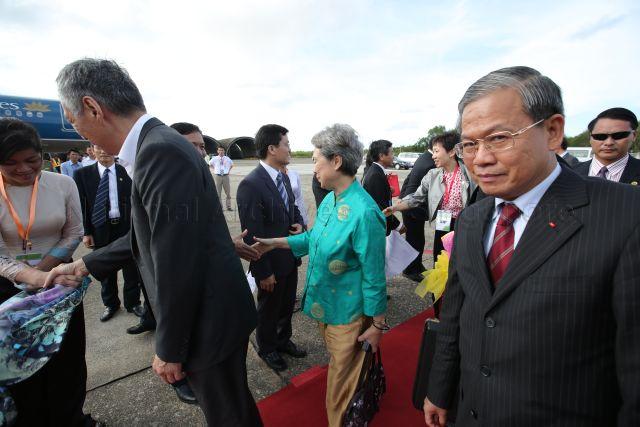 Prime Minister Lee Hsien Loong and PM Lee's wife, Madam Ho Ching and Minister (Prime Minister's Office), Second Minister for the Environment and Water Resources and Second Minister for Foreign Affairs Grace Fu (wearing a grey jacket), shaking hands with officials during their departure ceremony at the airport. PM Lee is on a three-day official visit to the Socialist Republic of Vietnam.