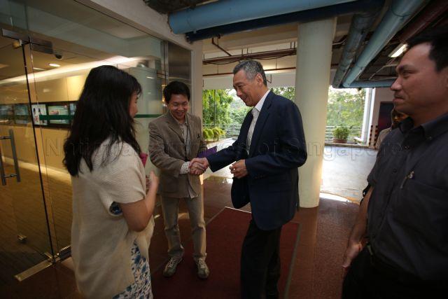 Mediacorp CEO Shaun Seow and Managing Director and Chief Editor of Channel NewsAsia (CNA) Debra Soon, greeting Prime Minister Lee Hsien Loong upon his arrival at Mediacorp TV theatre for a live English Forum-"Ask the Prime Minister".