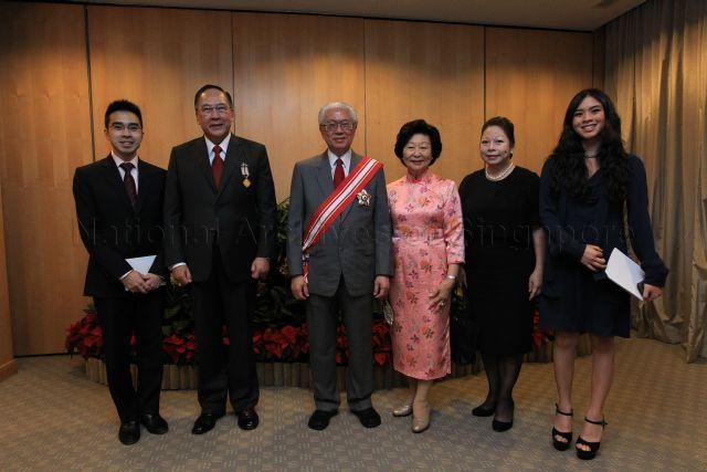 Group photograph of President and Mrs Tony Tan Keng Yam with recipient of Meritorious Service Medal, Chairman of Singapore Business Federation and former chairman of Duke-National University of Singapore (NUS) Graduate Medical School Singapore governing board Tony Chew Leong Chee and his family members during investiture of National Day awards at University Cultural Centre, National University of Singapore in Kent Ridge