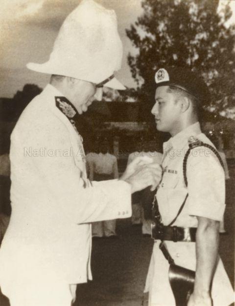 Chief Inspector Halford Boudewyn receiving the Colonial Police Medal (Silver) from Governor of Singapore, Sir Franklin Charles Gimson, 1948, for his role as a spy for the Allies, smuggling stolen documents of the Japanese plans for the invasion of India
