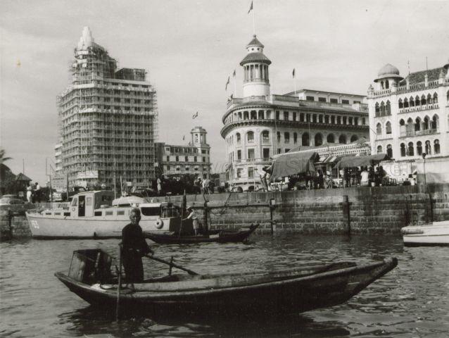 Singapore waterfront along Collyer Quay. The three prominent buildings are from left, Asia Insurance Building (under construction), Ocean Building and Alkaff Arcade.