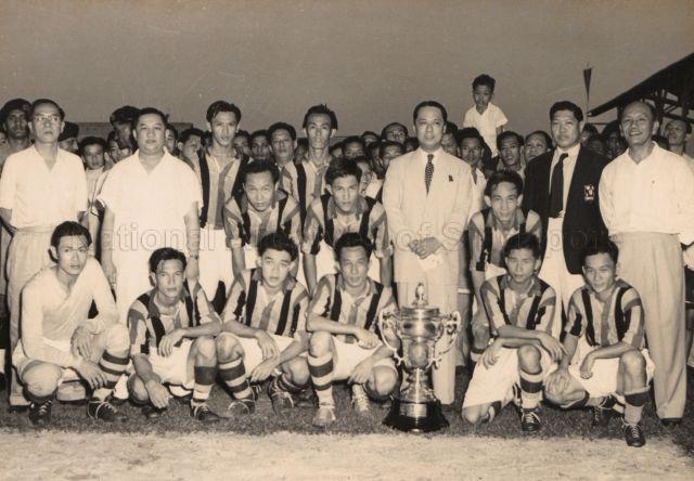 Group photograph of the Singapore Chinese Football Team after winning the M.C.F.A. cup in 1955. Chia Boon Leong is in the front row, second from the right.<br />