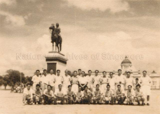 Group photograph of the Lien Hwa (United Chinese) team posing in front of King Rama V (King Chulalongkorn) monument in Bangkok