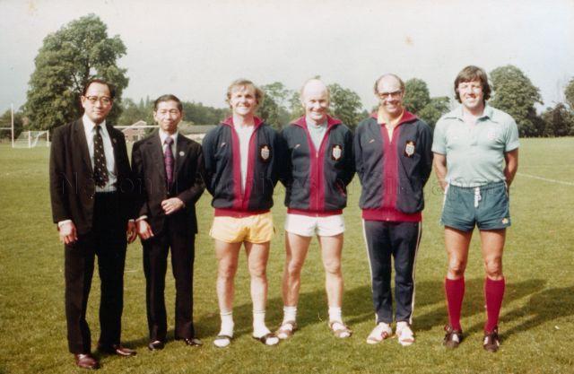 Group photograph of Chia Boon Leong and Yap Boon Chuan, another Football Association of Singapore (FAS) official taken with the trainers of Jita Singh and Mat Arrif Bujang. Jita and Mat Arrif were attending the International Preliminary Course conducted by FA in Bisham Abbey, a sports centre in England.<br />