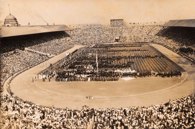 View of the Olympic country teams seen from the back of a packed London stadium at the 14th World Olympiads in 1948. Chia Boon Leong participated in the China Olympic Football Team.<br />