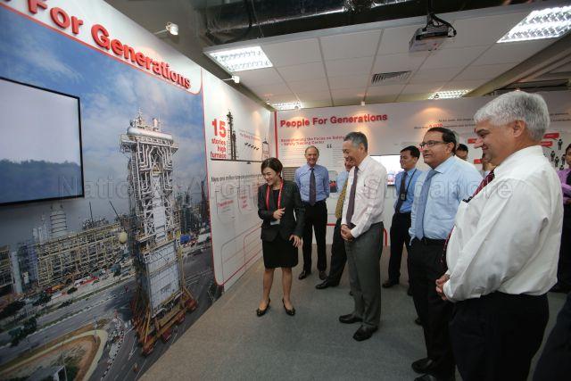 Taken at: Official launch of the Exxon-Mobil Singapore Chemical Plant Expansion at Exxon-Mobil ACB Building Pictured: Minister in the Prime Minister's Office and Second Minister for Home Affairs S Iswaran, Prime Minister Lee Hsien Loong and Managing Director of ExxonMobil Asia Pacific Pte Ltd Matthew Aguiar