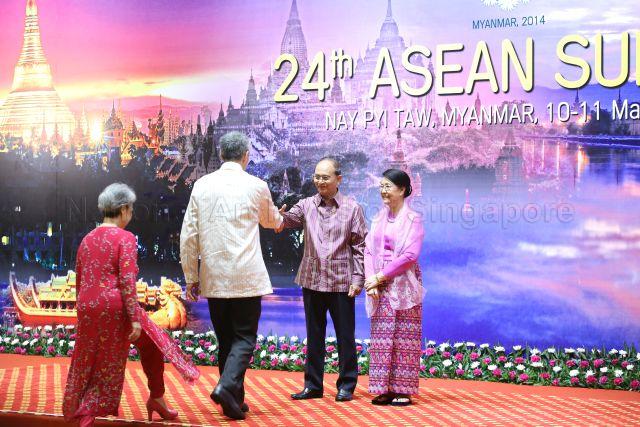 Prime Minister Lee Hsien Loong and wife Ho Ching being greeted by President of Myanmar and Chairman of ASEAN Thein Sein and wife Khin Khin Win, upon arrival for the welcome dinner of the 24th ASEAN Summit at Myanmar International Convention Centre in Nay Pyi Taw
