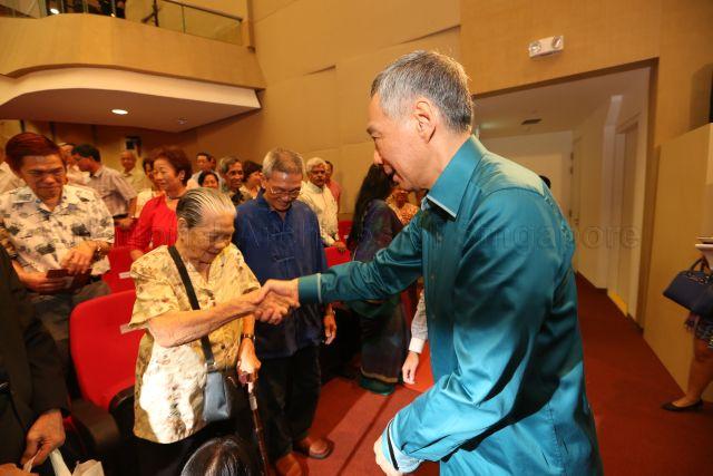 Prime Minister Lee Hsien Loong greeting Madam Wong Ah Woon, one of Pioneer Generation seniors, during National Day Rally at the auditorium, Institute of Technical Education (ITE) headquarters and College Central in Ang Mo Kio